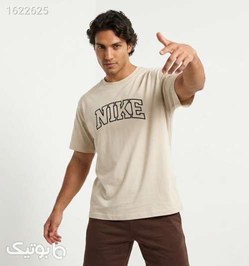 تیشرت Nike یقه گرد مردانه باکسی نخ پنبه طرح دار کرم 05 2026